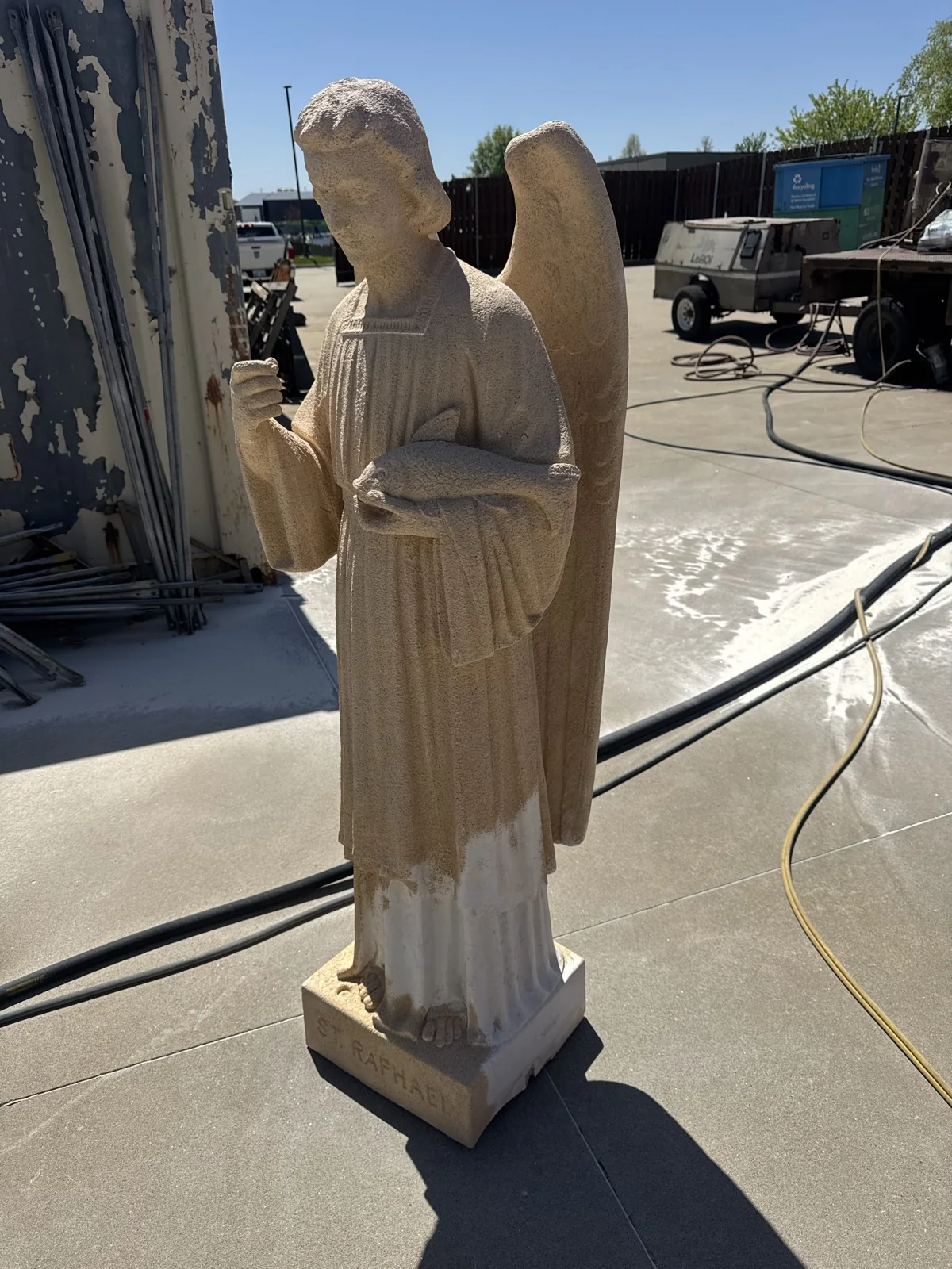 A statue from the same job, cleaned back to bare stone