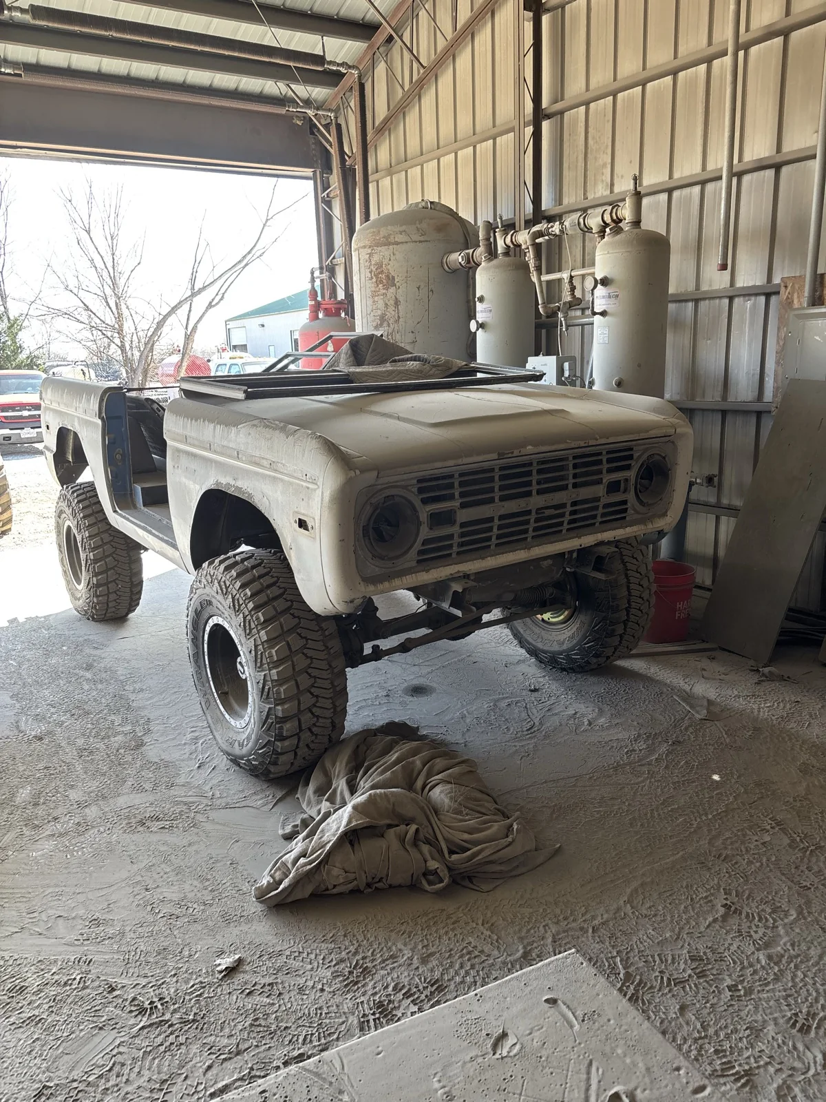 Ford Bronco in faded original paint before blasting