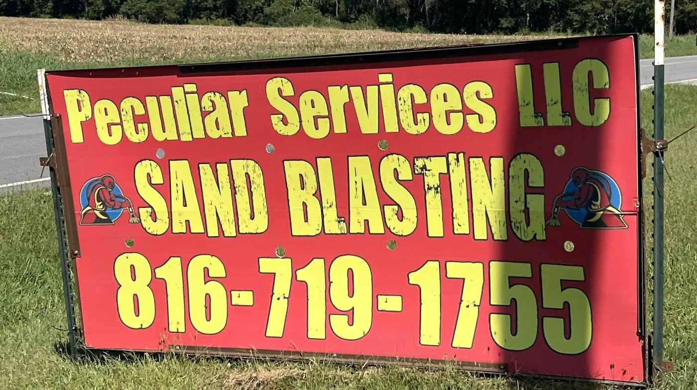 The Peculiar Services LLC sandblasting sign on State Route D
